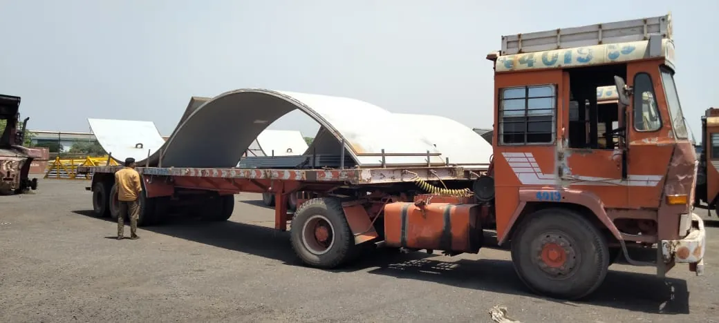 Curved steel plates loaded on a flatbed trailer