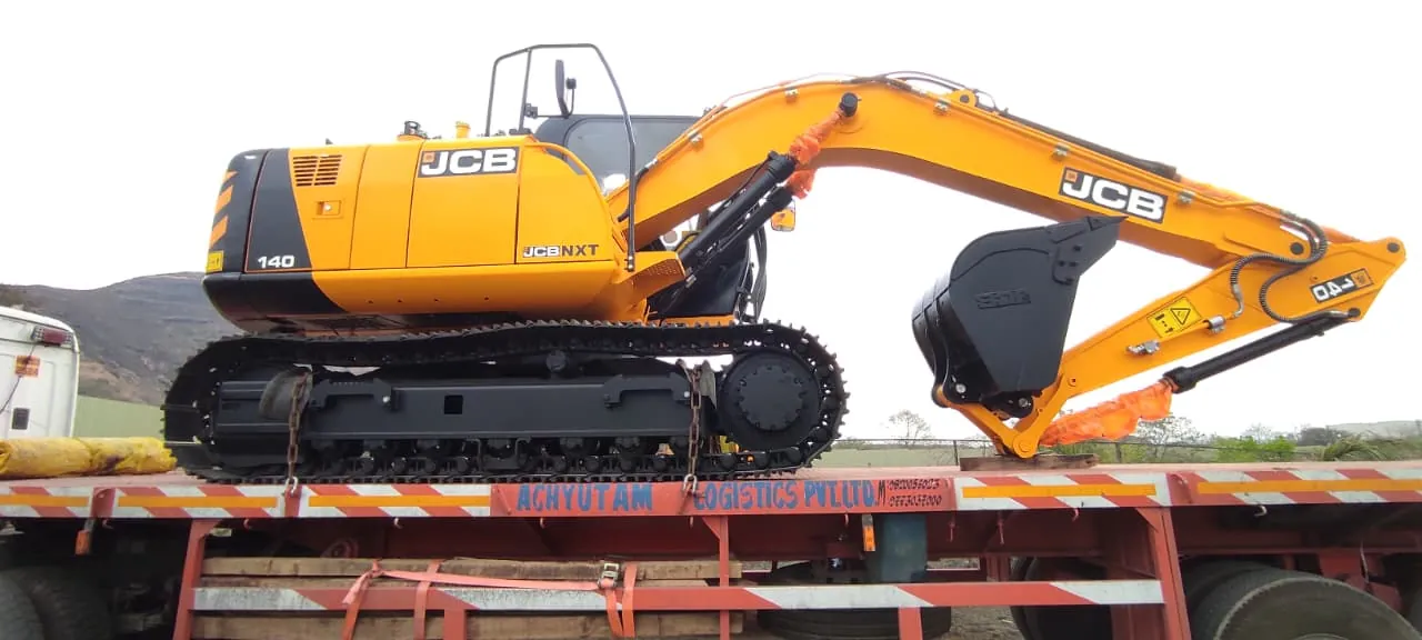 JCB excavator transported on an Achyutam Logistics trailer
